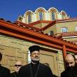 An Imam and Greek Orthodox clerics gather outside St. Demetrios Greek Orthodox Church in Waukegan at a news conference addressing vandalism of the church, which occurred the same night as a similar incident at a nearby mosque. From left are Imam Matthew Ramadan of the Council of Islamic Organizations of Greater Chicago, Rev. James Gordon of Ascension of Our Lord Greek Orthodox Church in Lincolnshire, Bishop Demetrios (center) of the Greek Orthodox Metropolis, Rev. Cosmas Halekakis, pastor at St. Demetrios and Rev. Sotirios Malamis (partially hidden), of St. John the Baptist Greek Orthodox Church in Des Plaines. (Chris Walker, Chicago Tribune / February 19, 2014)