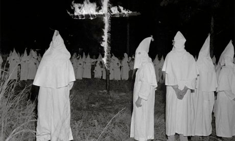 oded Ku Klux Klansmen posed for this exclusive picture Sept. 2, 1962 as they burn a cross as part of a statewide demonstration against racial integration in Talluah, Louisiana
