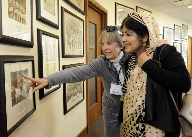 Betty Werthan, from Temple Congregation Ohabai Sholom, shows Ziaun Fakhruddin, from the Islamic Center of Murfreesboro, members of her family during a tour of the Temple on Sunday. / Sanford Myers / The Tennessean