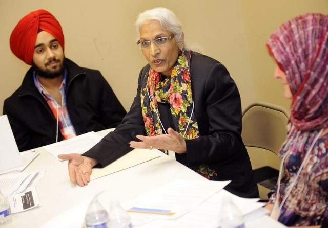 Swarn Kaur Birdee, middle, of the Sikh group, speaks as Lalli Singh, a Sikh, left, and Rhonda Gilmore of the Christian group listen during a meeting of Sikhs, Muslims and Christians at the Islamic Center of Williamson County. / Sanford Myers / The Tennessean
